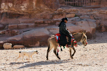 Petra, Jordan - February 18, 2020. Arab bedouin guides riding in the ancient city of Petra, Jordan.のeditorial素材