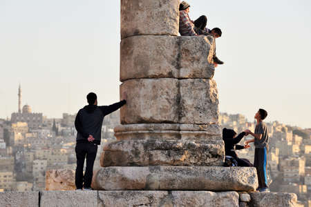 Amman, Jordan - February 15, 2020. Unidentified people at sunset in Amman Citadel, Jordan. The Amman Citadel is a historical site at the center of downtown Amman, the capital of Jordanのeditorial素材