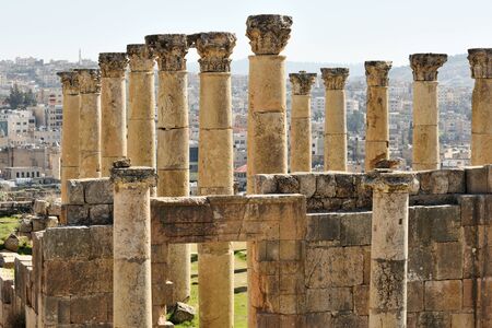 Columns and wall of ruined Greco-Roman city of Gerasa in Jerash, Jordanの写真素材