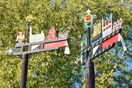 Wooden carved weather vane in Preila, Lithuania. Designs and the symbolism brings identity, culture to this design element. Weather vane, wind vane, weathercock shows direction of windのeditorial素材