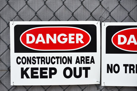 Danger Construction Area, Keep Out sign on fenceの写真素材