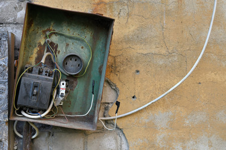 Electric box is very old, dirty and danger open.