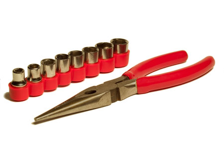 pliers and wrench heads isolated on white backgroundの写真素材