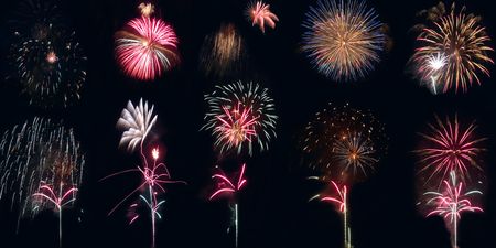cmbination of some fireworks isolated on dark backgroundの写真素材