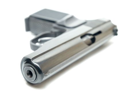 high key close-up of gun isolated on white shallow dofの写真素材