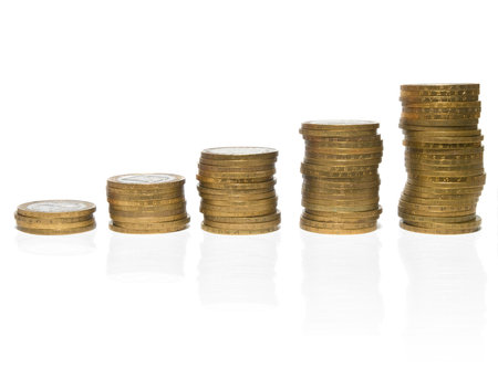 five stacks of coins isolated on white. growth concept