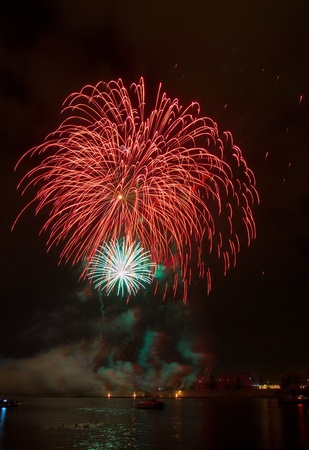 colourful fireworks display over the riverの写真素材