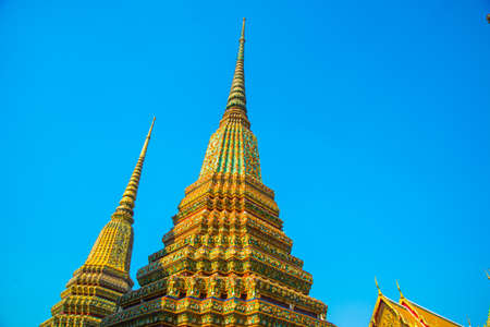 A beautiful Buddhist temple with gold in the capital of Thailandの写真素材