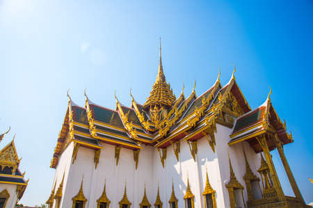 A beautiful Buddhist temple with gold in the capital of Thailandの写真素材