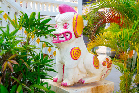 formidable statue at the entrance of a Buddhist templeの写真素材