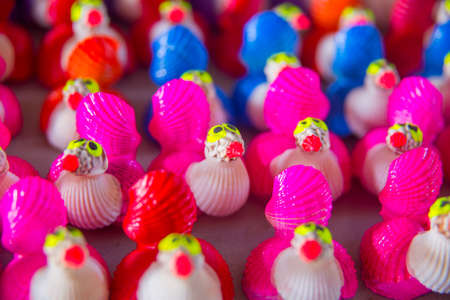 Lots of colorful, unusual and funny toys is on the tableの写真素材