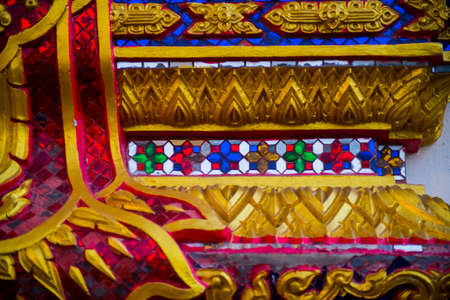 A fragment of decoration of the temple with a Golden imageの写真素材