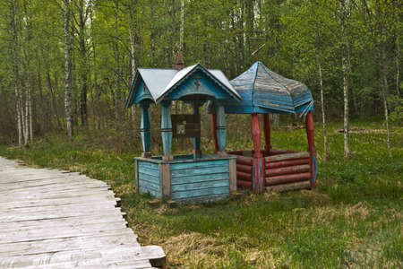 Old icons are hanging, the little well where the river flowsの写真素材