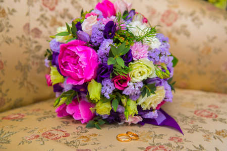 Beautiful gold jewelry lying around flowers.Wedding.Loveの写真素材