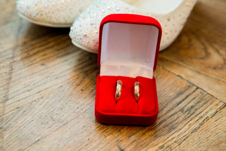 Beautiful gold jewelry lying around flowers.Wedding.Loveの写真素材