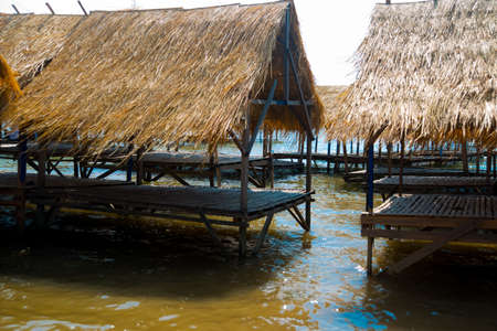 Island with houses made of straw near the river in Cambodia.の写真素材
