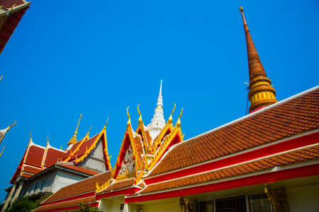 Ancient Buddhist temples with gold in a small town in Thailand.Khon Kaen