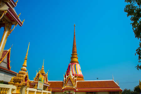 Ancient Buddhist temples with gold in a small town in Thailand.Khon Kaen