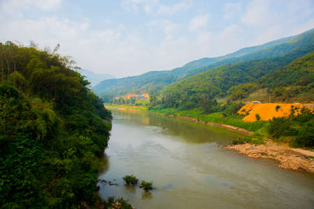 Beautiful mountain river in Laos in cloudy weather,the city Nonken.の写真素材