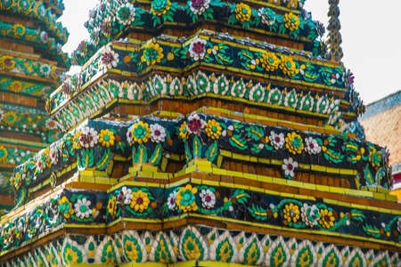 Wat Pho or Wat Phra Chetuphon,the Temple of the Reclining Buddha in Bangkok of Thailand.Wat Pho, Temple of Reclining Buddha.A fragment of decoration with flowersの写真素材
