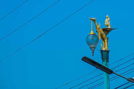 Streetlight isolated on blue skyの写真素材