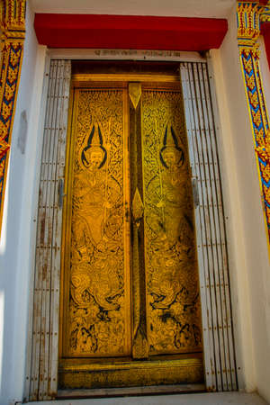 Beautiful religious building is white with gilding on a blue sky . Ayutthaya. Thailand.の写真素材