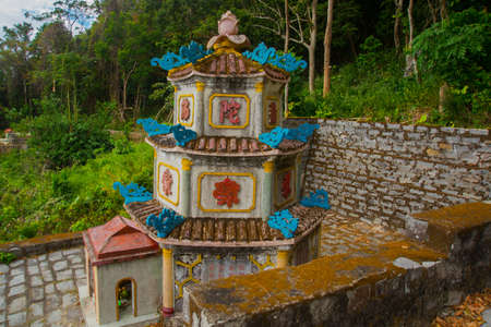 Pagoda in Ta Cu mountain, Binh Thuan province, Vietnam.Temples..Asia. Vietnam.Phan Thiet.,summer.Mountains in the distance and green leaves on the trees.の写真素材