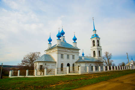 The Orthodox Church is white with blue domes in Russia.The bell-tower.の写真素材