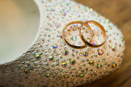 Beautiful gold jewelry lying around flowers.Wedding.Loveの写真素材