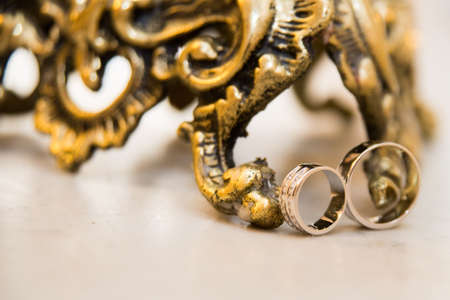 Beautiful gold jewelry lying around flowers.Wedding.Loveの写真素材