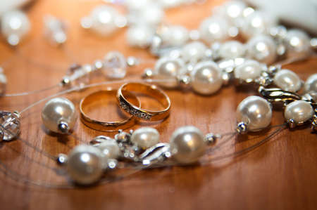 Beautiful gold jewelry lying around flowers.Wedding.Loveの写真素材