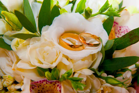 Beautiful gold jewelry lying around flowers.Wedding.Loveの写真素材