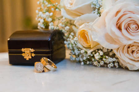Beautiful gold jewelry lying around flowers.Wedding.Loveの写真素材