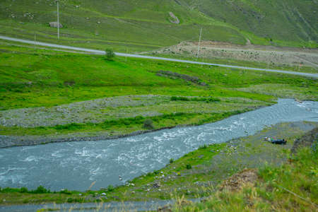The peaks of blue-green mountains against the sky,the summer.The Caucasus..Russia.の写真素材