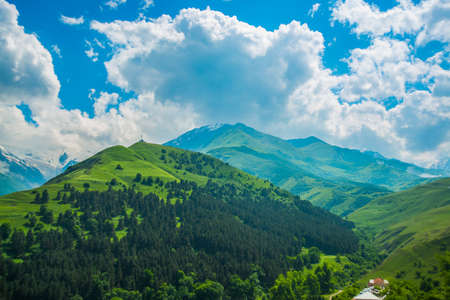 The peaks of blue-green mountains against the sky,the summer.The Caucasus..Russia.の写真素材