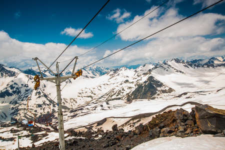 Beautiful mountains in the white snow against the blue sky in the clouds.Winter.The Elbrus region.The Caucasus.Russia.の写真素材