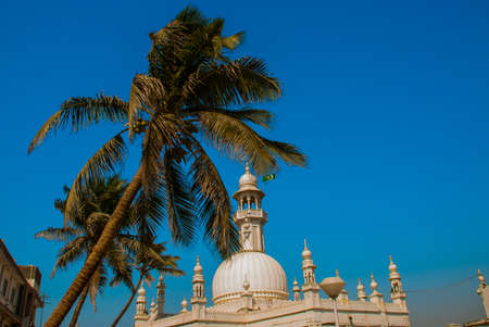 Fragment of a building on blue sky background. Palma. Mosque in middle of the sea in Mumbai. Haji Ali.の写真素材