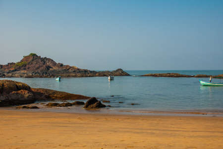 Beautiful beach with rocks and blue sea. Om beach, Gokarna, Karnataka, India
