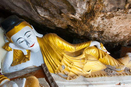 Big Buddha statue which rests in a gold dress, religious carving. Hpa-An, Myanmar. Burma.の写真素材