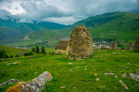 Beautiful mountains in the clouds on the blue sky background,the summer.The Caucasus..Russia.の写真素材