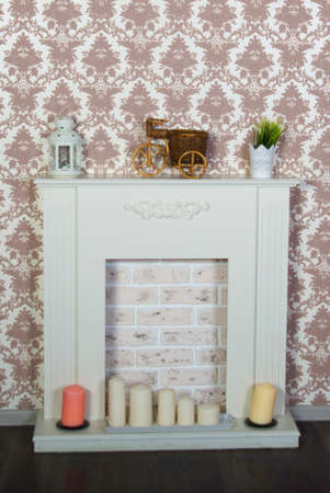 Interior with a beautiful fireplace and candlesの写真素材