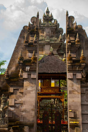 Beautiful Balinese entrance gate of the temple, a Hindu temple in the center of Ubud, Bali, Indonesia.の写真素材