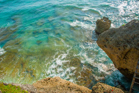 Beautiful view of a cliff and the sea in Bali Indonesia. Uluwatu, Pantai Suluban.