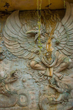 Wall of rock on which there is a relief image. Public Area. Garuda Wisnu Kencana Cultural Park. Bali. Indonesia. GWK.の写真素材