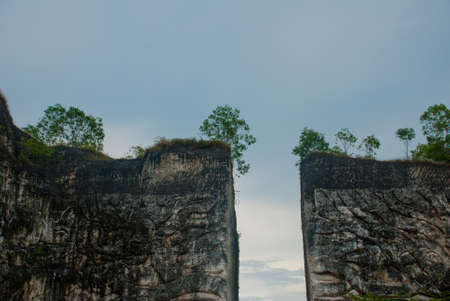 Wall of rock on which there is a relief image. Public Area. Garuda Wisnu Kencana Cultural Park. Bali. Indonesia. GWK.の写真素材