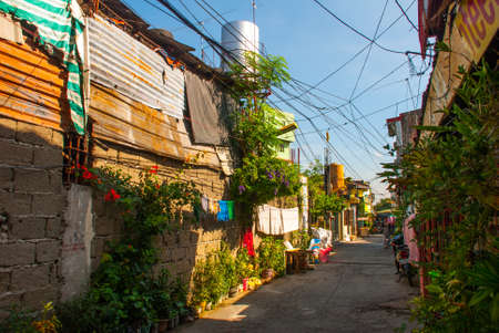 Ordinary Local street with houses in the Philippines capital Manilaの写真素材