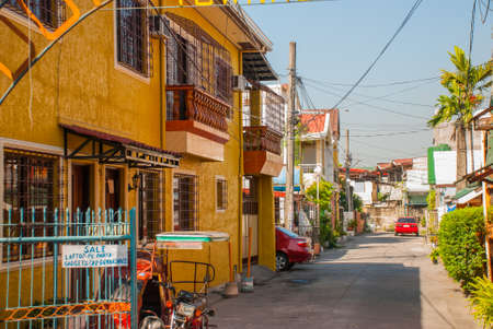 Ordinary Local street with houses in the Philippines capital Manilaの写真素材