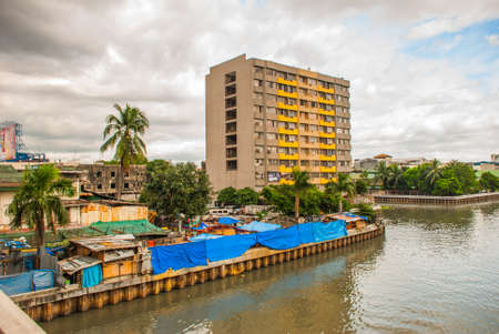 The view from the bridge over the river and skyscrapers in the capital Manila, Philippinesの写真素材