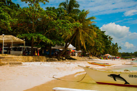Boats at tropical white beach with sand beach of Panglao. Island, Bohol Province. Philippinesの写真素材