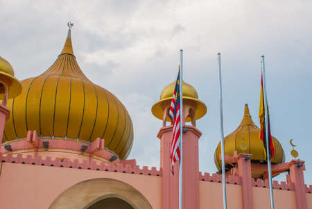 Kuching City Mosqueat day time, Sarawak, Malaysia. Masjid Bahagian. Pink mosque against cloudy sky.の写真素材